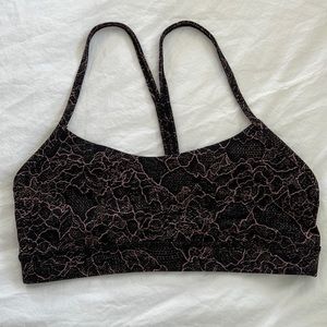 Lululemon sports bra with pink and black design